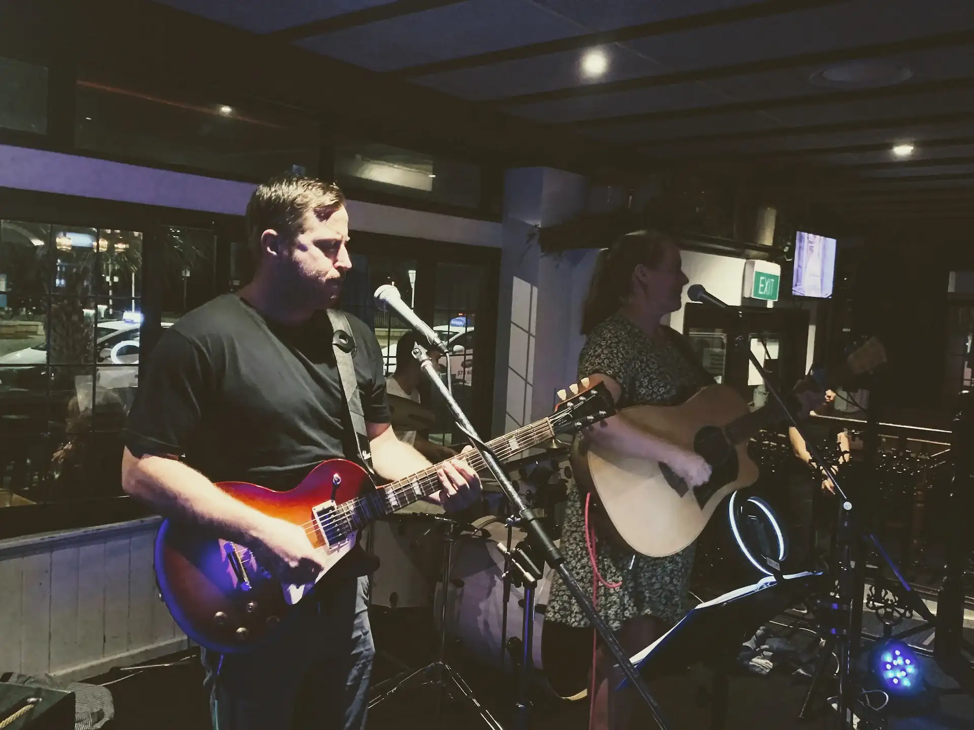 Billy from Stolen Jukebox playing lead guitr at an event in Tauranga